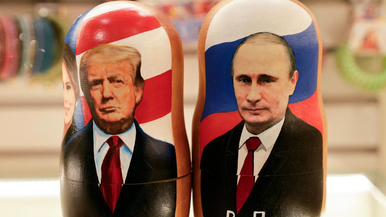 Traditional Russian wooden nesting dolls, Matryoshka dolls, depicting Russia's President Vladimir Putin (R) and US President Donald Trump. Picture: TATYANA MAKEYEVA / AFP