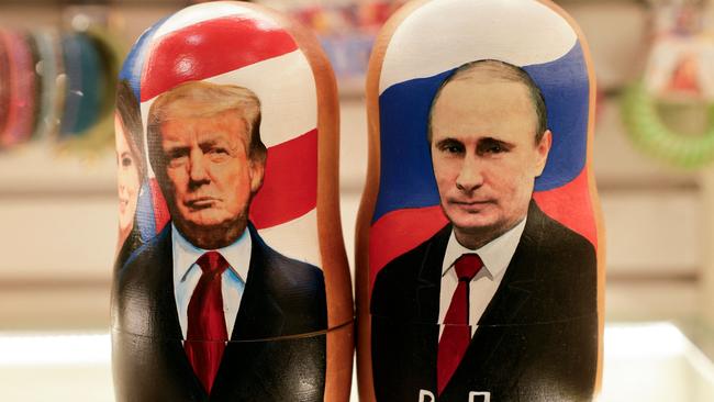 Traditional Russian wooden nesting dolls, Matryoshka dolls, depicting Russia's President Vladimir Putin (R) and US President Donald Trump. Picture: TATYANA MAKEYEVA / AFP