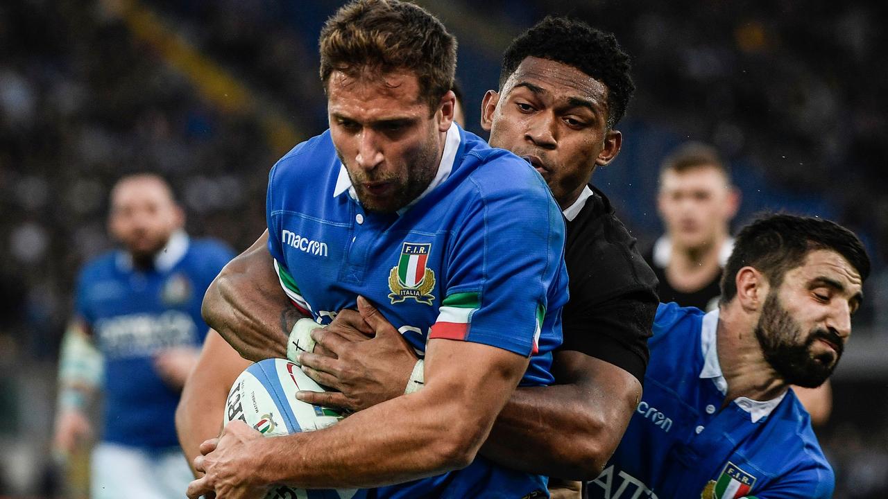 Italy centre Tommaso Benvenuti is tackled by All Blacks winger Waisake Naholo in Rome.