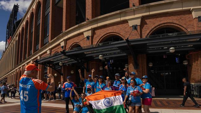 Fans celebrate. Picture: Adam Gray/Getty Images/AFP