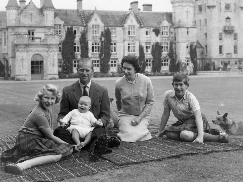 Queen Elizabeth II and Prince Philip, Duke of Edinburgh with their children, Prince Andrew (centre), Princess Anne (left) and Charles, Prince of Wales sitting on a picnic rug outside Balmoral Castle in Scotland. Picture: Getty