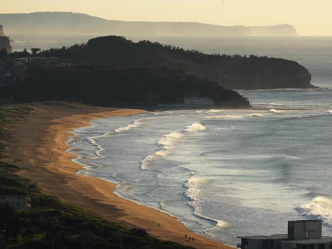 An early morning fishing expedition to North Narrabeen ended up with police arranging for bogged 4WDs to be towed from the beach. Picture John Grainger