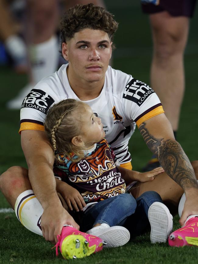 Reece Walsh and his daughter after full time. Picture: Adam Head