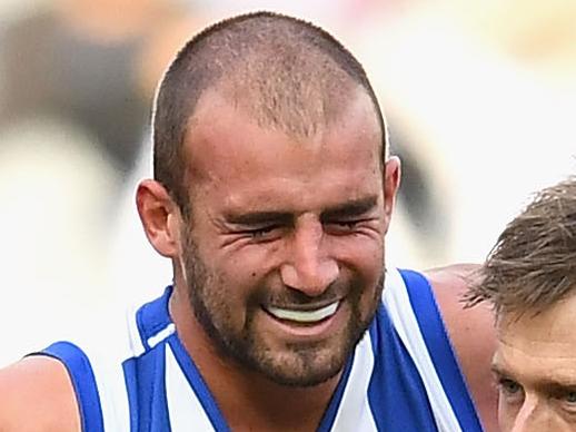 MELBOURNE, AUSTRALIA - MAY 21:  Ben Cunnington of the Kangaroos is attended to by a trainer during the round nine AFL match between the Melbourne Demons and the North Melbourne Kangaroos at Melbourne Cricket Ground on May 21, 2017 in Melbourne, Australia.  (Photo by Quinn Rooney/Getty Images)