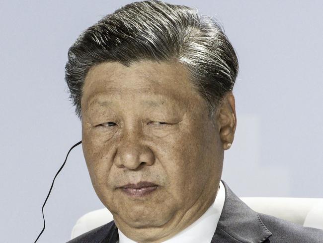 President of China Xi Jinping looks on at a meeting during the 2023 BRICS Summit at the Sandton Convention Centre in Johannesburg on August 24, 2023. (Photo by MARCO LONGARI / AFP)