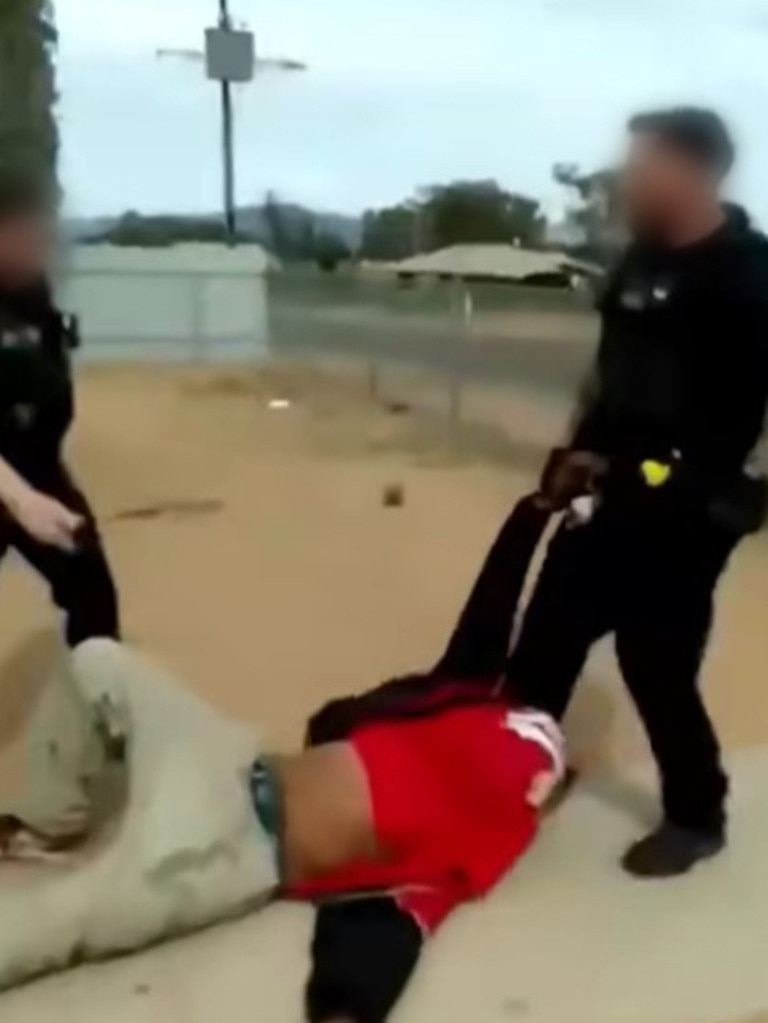 Footage shared to Facebook shows a Port Augusta police officer dragging a man along the ground. Picture: Facebook
