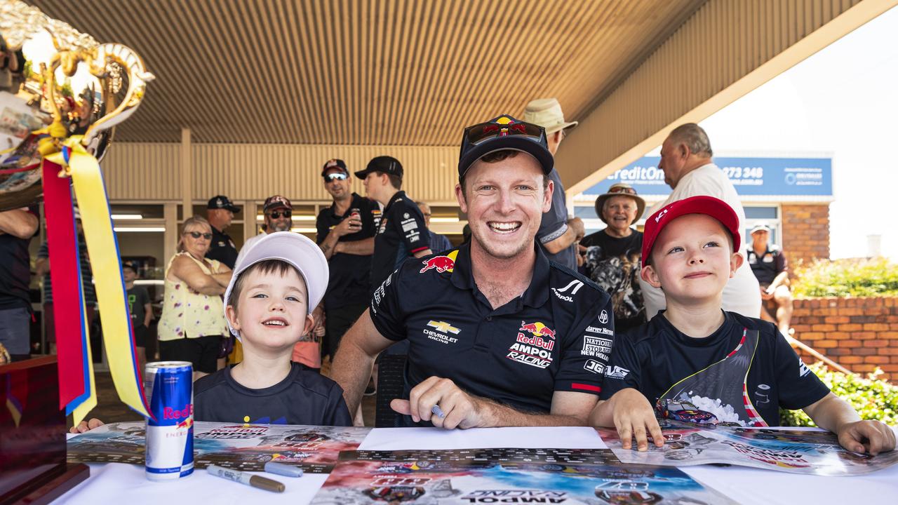 Supercar champion Will Brown with Patrick (left) and George Weber at an appearance at Cars Galore in Toowoomba, Sunday, November 24, 2024. Picture: Kevin Farmer