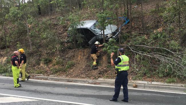 Emergency services crews at the scene of a crash at Tamborine Oxenford Road. Photo: Nicholas McElroy