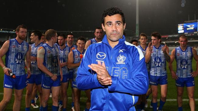 Lindsay Thomas leads the Kangaroos off the field after the win over West Coast.