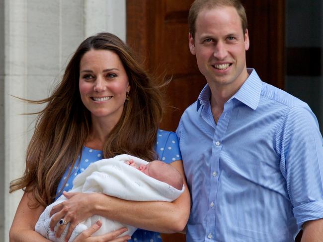 Outside the Lindo wing with Prince George in 2013. Picture: AFP PHOTO / ANDREW COWIE / AFP PHOTO / ANDREW COWIE