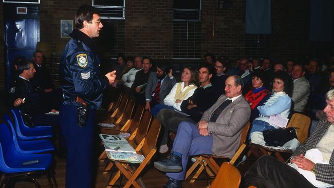 Pat Daley, then in the NSW Police, speaking at a Neighbourhood Watch meeting in the 1980s. Picture: Supplied