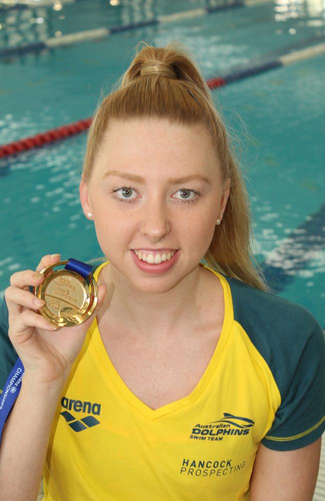 Lakeisha Patterson with the gold medal she won at world para swimming titles. Photo: Alan Quinney