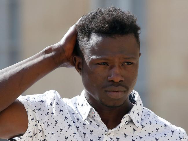 Mamoudou Gassama leaves the presidential Elysee Palace after his meeting with President Macron. Picture: Thibault Camus/AFP