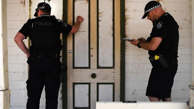 Queensland Police officers knocking on the door of a home. File image. Picture: AAP Image/Dan Peled