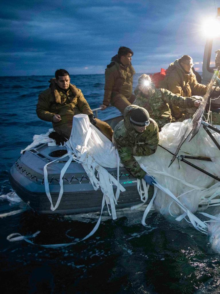 Divers recover wreckage from the balloon. Picture: Supplied