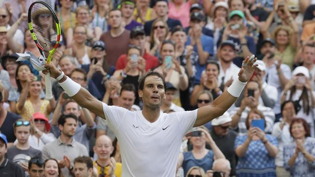 Spain's Rafael Nadal celebrates after beating Australia's Nick Kyrgios in a Men's singles match during day four of the Wimbledon Tennis Championships in London, Thursday, July 4, 2019. (AP Photo/Kirsty Wigglesworth)