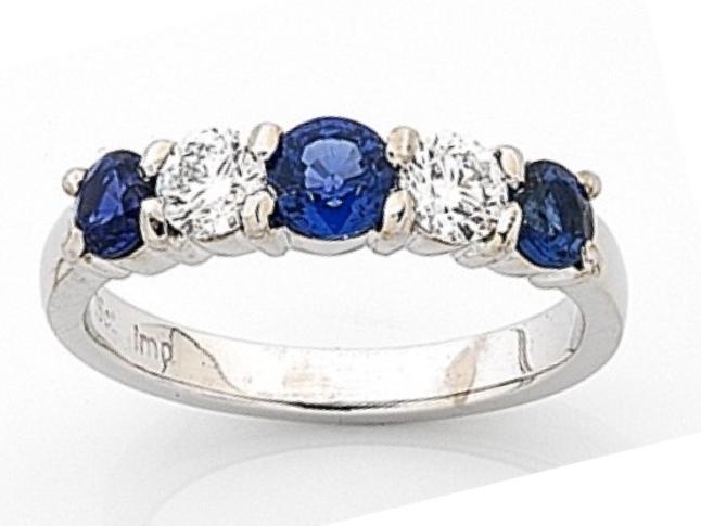 Sapphire and diamond ring — 3 all 1.13ct sapphires, 2 .64ct diamonds — Stamped Imp $5950