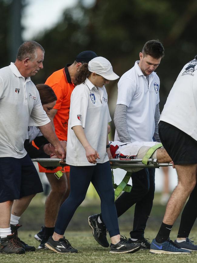 Sullivan is stretchered off. Pictures: Valeriu Campan