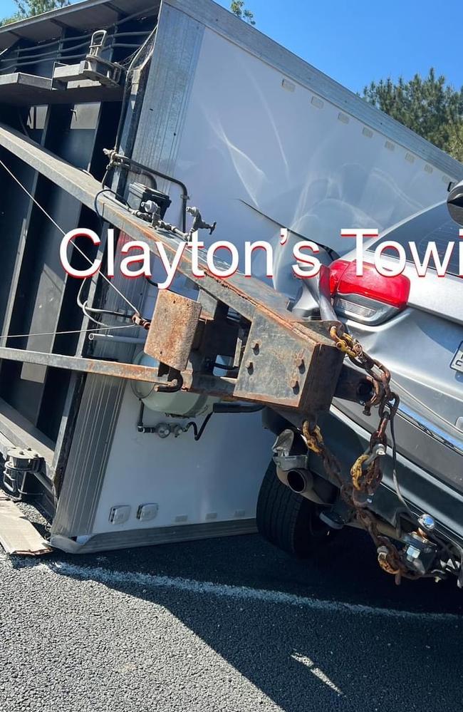 A car and a trailer jackknifed on the Bruce Hwy, causing major traffic headaches. Photos: Claytons Towing