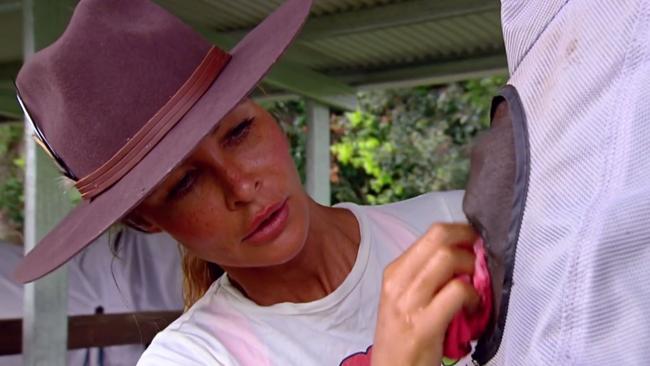 Nicola Watson grooms one of her horses at the farm, and made a rare appearance during the segment.