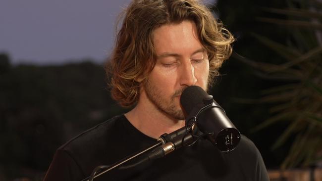 Dean Lewis recording his performance of Falling Up on Balmoral Beach for the Ellen Show. Picture: Supplied.