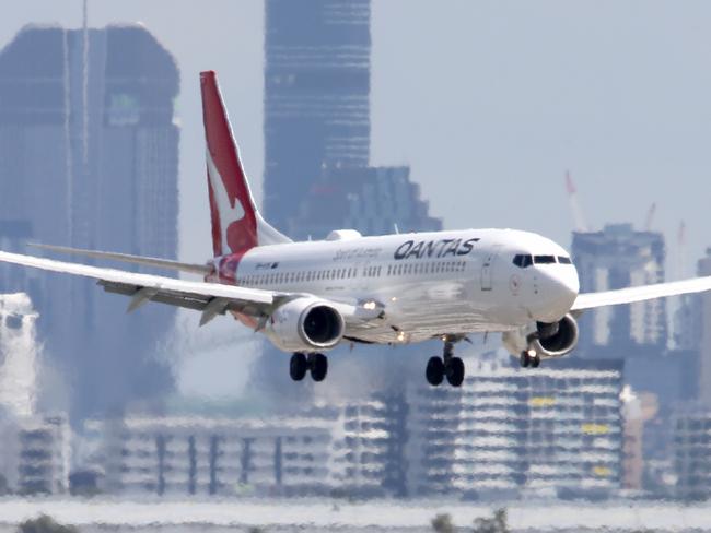 Qantas plane lands, New flight paths for Brisbane Airport, Monday 4th April 2022 - Photo Steve Pohlner