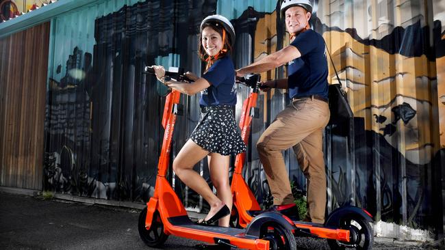 Neuron head of communications Joe Oliver and Adelaide city launcher Valeri Inting with the new Neuron Scooters. Picture: Tricia Watkinosn