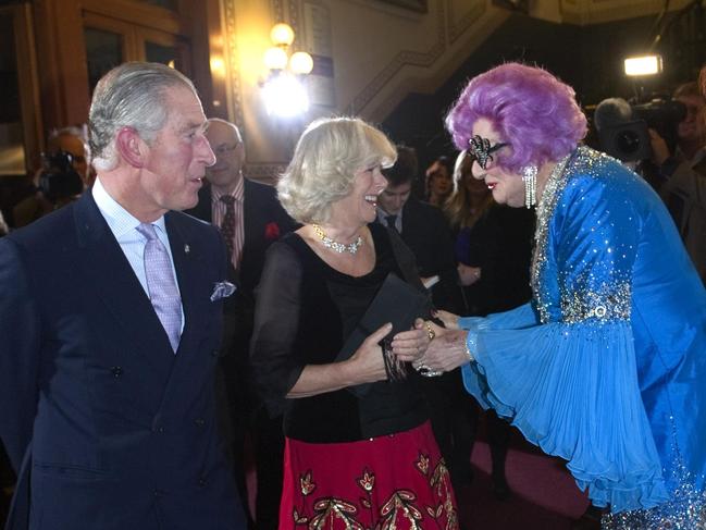 King Charles and Queen Camilla, pictured with Barry Humphries in character as Dame Edna Everage, at The Prince's Trust Rock Gala, in London in 2010.