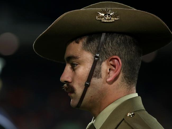 CANBERRA, AUSTRALIA - APRIL 25: Anzac Day ceremony ahead of the round seven AFL match between Greater Western Sydney Giants and Brisbane Lions at Manuka Oval on April 25, 2024 in Canberra, Australia. (Photo by Jason McCawley/AFL Photos/via Getty Images )