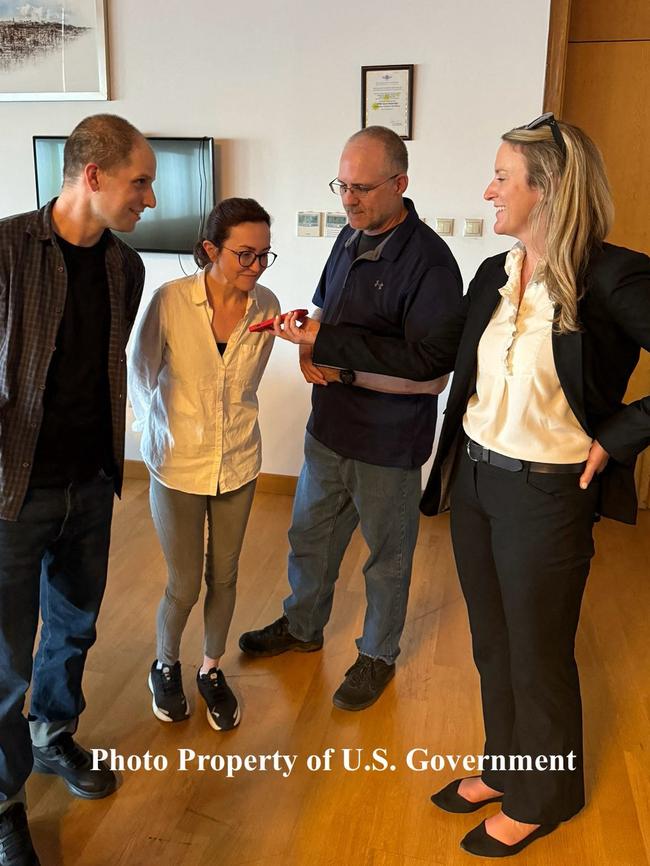 Evan Gershkovich (L), US-Russian journalist Alsu Kurmasheva (C) and former US Marine Paul Whelan (R) on the phone with President Joe Biden after their release from Russia in Ankara, Turkey. Picture: US Government / AFP