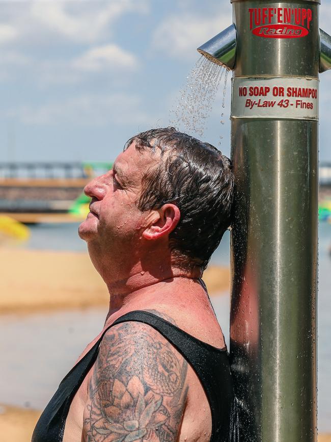 Phillip Roberton cools off at the Darwin Waterfront as hot weather continues. Picture: Glenn Campbell