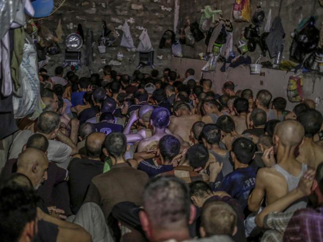 Hundreds of suspected Islamic State members swept up by Iraqi forces in Mosul are being held in a cramped and stifling prison just outside the city. Picture: Bram Janssen/AP