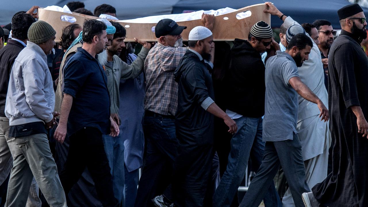 A coffin containing the body of a victim of the Christchurch terrorist attack is carried for burial at Memorial Park Cemetery on March 20, 2019 in Christchurch, New Zealand. Picture: Carl Court/Getty Images.