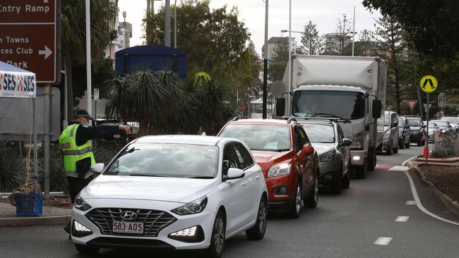 The hard border and long queues return to the Qld NSW border on the Gold Coast. People getting the thumbs up or turned away in Griffith St Coolangatta. Picture: Glenn Hampson.