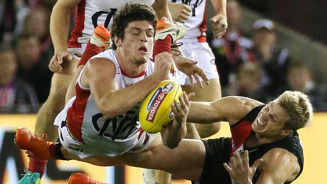 Melbourne’s Angus Brayshaw is tackled by St Kilda’s Nick Riewoldt. Picture: George Salpigtidis