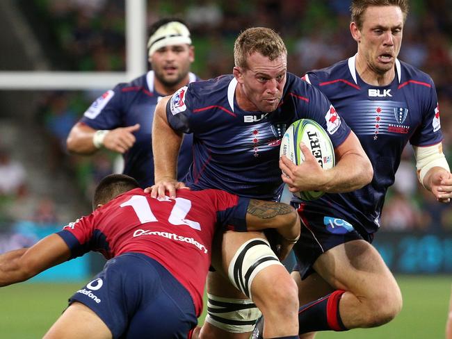 Angus Cottrell of the Rebels is tackled by Duncan Paia'Aua of the Reds during the round 2 Super Rugby match between the Melbourne Rebels and the Queensland Reds at AAMI Park in Melbourne, Friday, February 23, 2018. (AAP Image/Hamish Blair) NO ARCHIVING, EDITORIAL USE ONLY