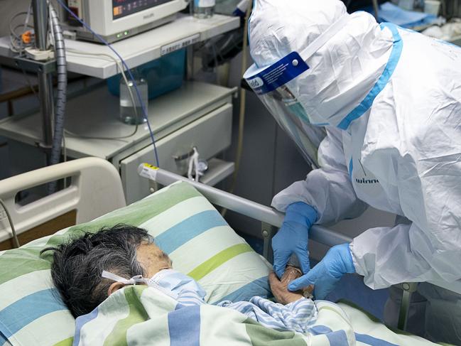 A patient in the intensive care unit at Zhongnan Hospital of Wuhan University in Wuhan in central China’s Hubei Province. Picture: AP/Xiong Qi/Xinhua