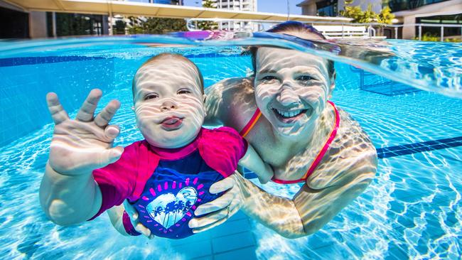 Former Olympic swimmer Melanie Wright with daughter Madison, 1, ahead of the launch of Learn to Swim Week, a national campaign to teach kids to swim for free. Picture: Nigel Hallett