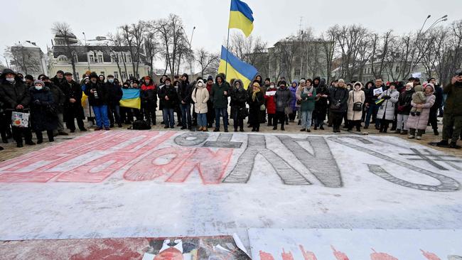 People rally in front of a huge placard reading "Say No To Putin" in Kiev. Picture: AFP.