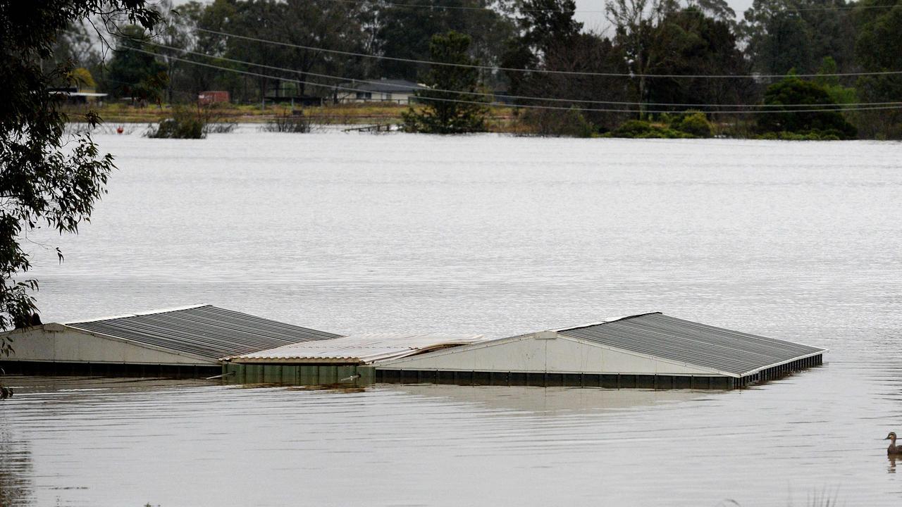 The roof a flooded house near the overflowing Hawkesbury River this winter. Picture: Muhammad FAROOQ / AFP