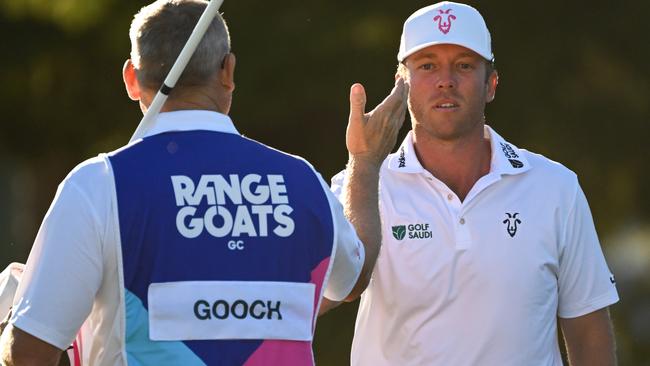 ADELAIDE, AUSTRALIA - APRIL 22: Talor Gooch of RangeGoats GC shakes hands with his caddie after finishing his round during day two of Liv Golf Adelaide at The Grange Golf Course on April 22, 2023 in Adelaide, Australia. (Photo by Asanka Ratnayake/Getty Images)