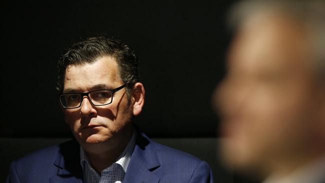 Victorian Premier Daniel Andrews looks on whilst Victorian Chief Health Officer Brett Sutton speaks to the media during a press conference in Melbourne, Victoria. Picture: NCA NewsWire / Daniel Pockett