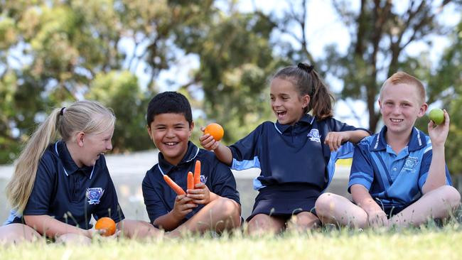 Kids from Windale Public School near Newcastle took part in the "Swap It" program which encourages healthy eating at school. Pictured are school mates, (left) Ashlyn Southern, 10, Mataio Thompson, 8, Ruby-Anne Davidson, 10 and Taylor Adam, 11. Picture: David Swift