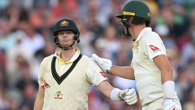 Cummins and Smith are keeping Australia in the game. (Photo by Stu Forster/Getty Images)