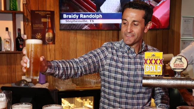 Leader of the Opposition David Crisafulli pours a beer at Chute 1 pub, Longreach. Picture: Liam Kidston.