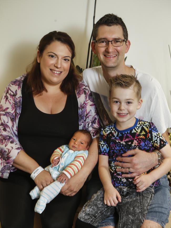 Charlie was the last baby born at Knox Private Hospital. Jenna and John Newbigin with the newborn and his brother Harry. Picture: Valeriu Campan