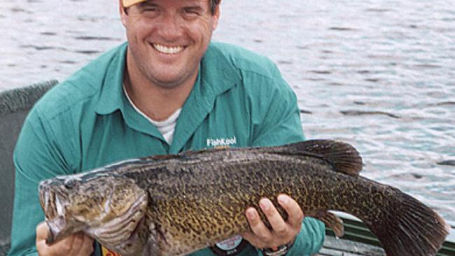 Mark Pertot form Davo's Bait and Tackle with a 5kg Mary River Cod he caught and released in January 2005. Line fishing in the Mary River and its tributaries upstream of Six Mile Creek will be banned as of August 1, to help protect and recover the endangered endemic fish species.