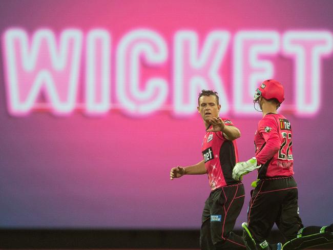 Stephen O'Keefe of the Sixers takes the wicket of Callum Ferguson of the Thunder during the Big Bash League (BBL) match between the Sydney Sixers and the Sydney Thunder at the SCG in Sydney, Saturday, February 2, 2019. (AAP Image/Steve Christo) NO ARCHIVING, EDITORIAL USE ONLY, IMAGES TO BE USED FOR NEWS REPORTING PURPOSES ONLY, NO COMMERCIAL USE WHATSOEVER, NO USE IN BOOKS WITHOUT PRIOR WRITTEN CONSENT FROM AAP