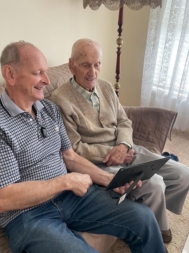 Polish immigrant Jozef Pilarski (right) who lives in New Lambton turns 102 on 26th April, 2025, and was a WWII survivor, with his son Kas Pilarski (left) Supplied.