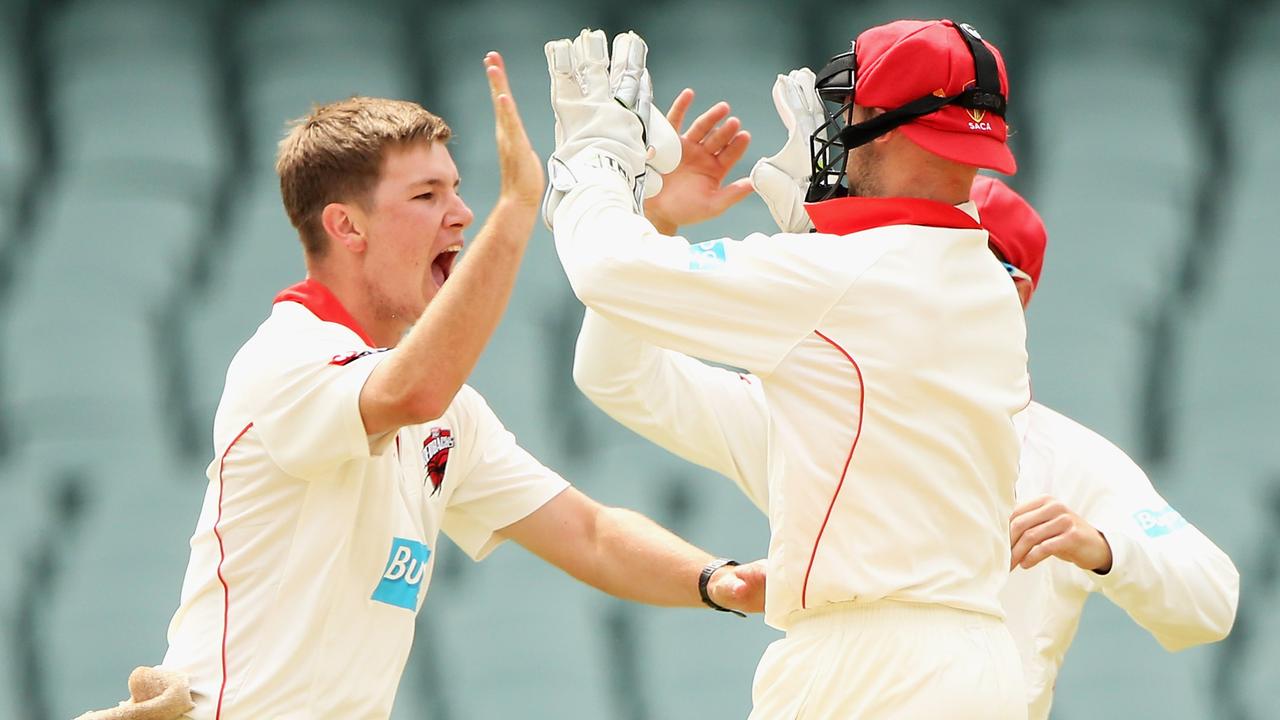ADELAIDE, AUSTRALIA - NOVEMBER 03: Adam Zampa of the Redbacks celebrates with Tim Ludeman of the Redbacks after taking a wicket during day four of the Sheffield Shield match between South Australia and Queensland at Adelaide Oval on November 3, 2014 in Adelaide, Australia. (Photo by Daniel Kalisz/Getty Images)